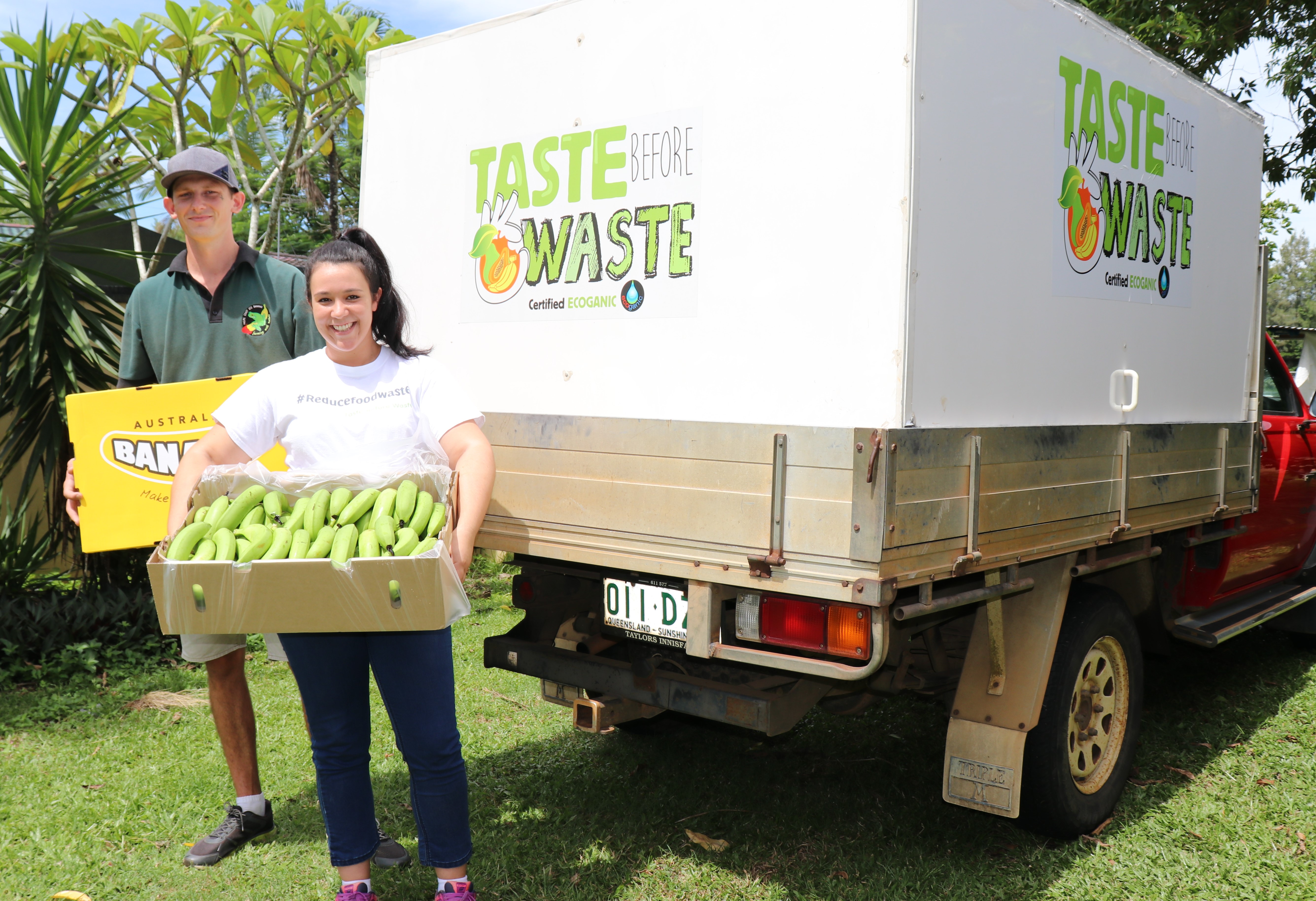 Alana Sciacca and her partner Jake Siltanen with some of the seconds bananas they deliver to households across North Queensland.