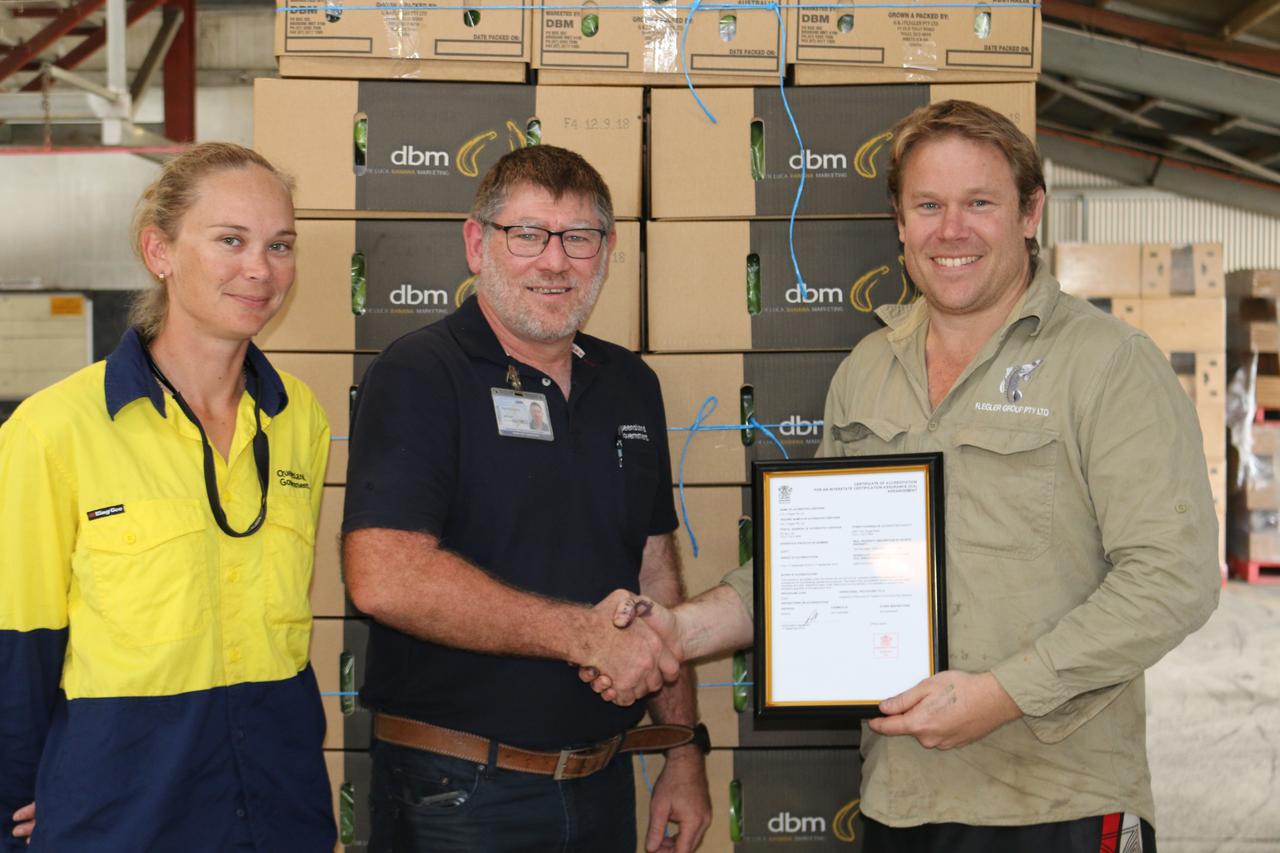 Tully grower Warwick Flegler (pictured right) receiving his Interstate Certification Assurance(ICA) Accreditation allowing him to certify his own fruit consignments. He is pictured with BQ
Compliance Officer Jess Portsch and BQ Compliance Manager Paul Garland.