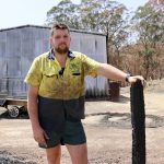 Clinton Welsh with the trailer and shed he lost during the recent bushfires.