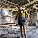 Clinton Welsh inside his packing shed which was gutted by fire.
